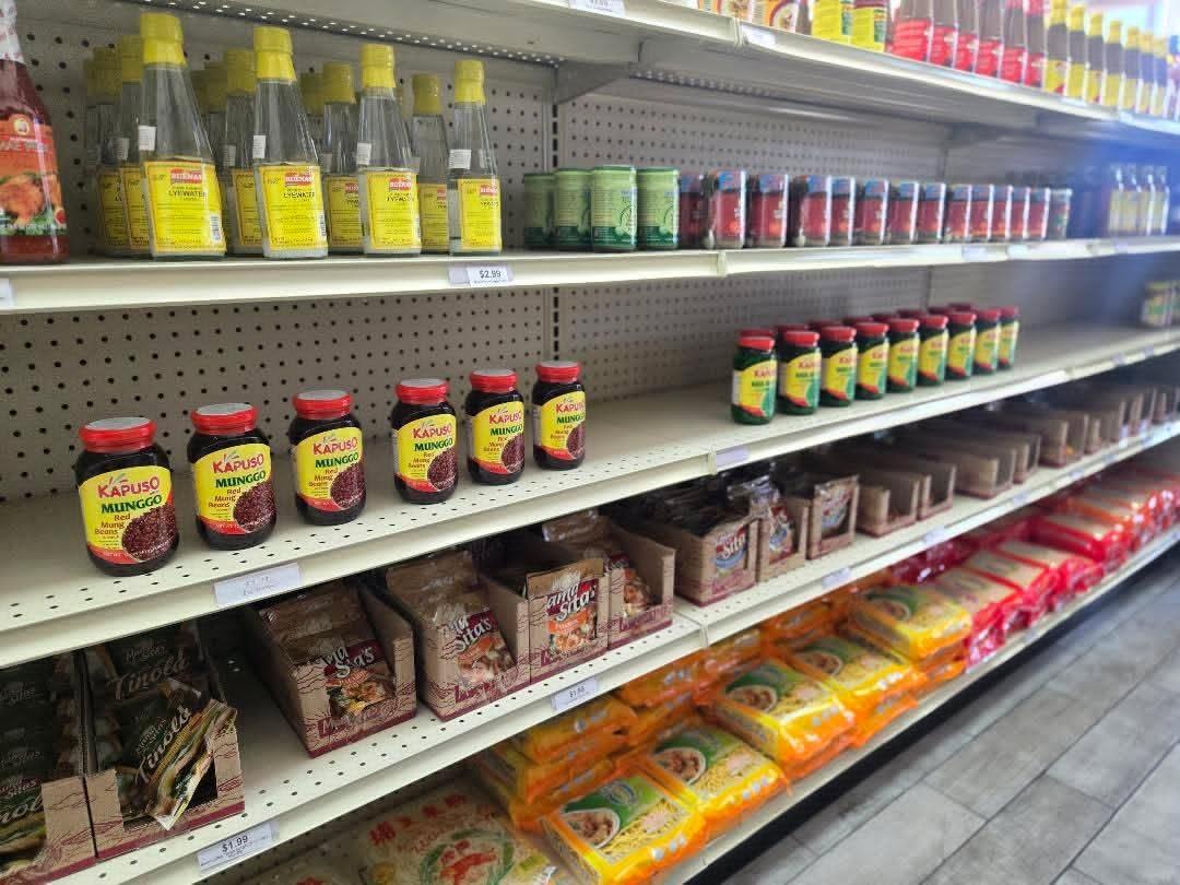 Shelf of Filipino vinegars and soy sauces at Pips
